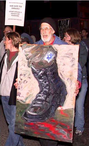 Man holding jackboot with swastika.