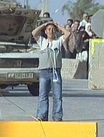 A television image showing Hussam wearing a bomb belt as he was stopped at the checkpoint. (AP)