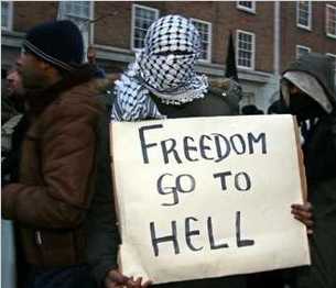 Muslim demonstrator with sign: 'Freedom go to Hell'