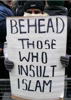 Muslim demonstrator with sign: 'BEHEAD THOSE WHO INSULT ISLAM'