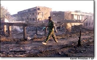 A police officer patrols the destruction at the Paradise Hotel