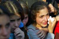 Girl crying at Noy and Dvir's funeral