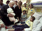 Prime Minister Sharon visits 8-year-old Haya Schijveschuurder, wounded in the Sbarro bombing.  Both of her parents were killed