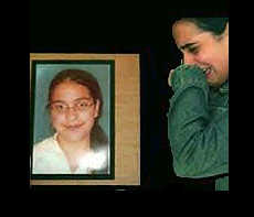 Young Israeli girl weeping at picture of murdered relative.